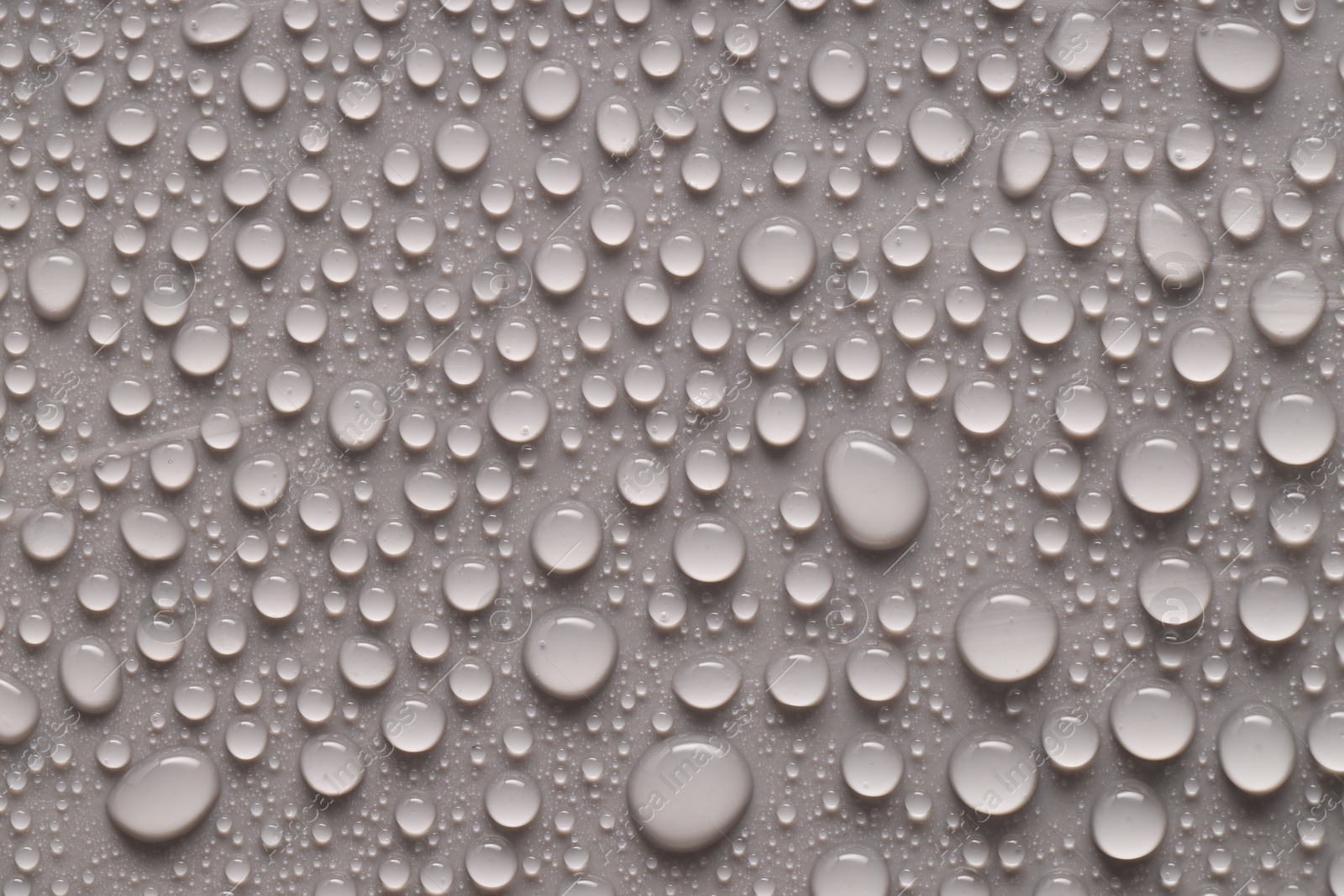 Photo of Water drops on gray background, top view