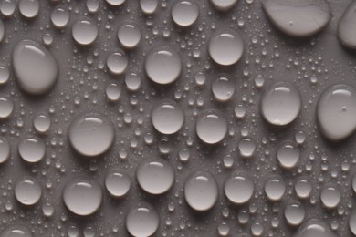 Photo of Water drops on gray background, top view