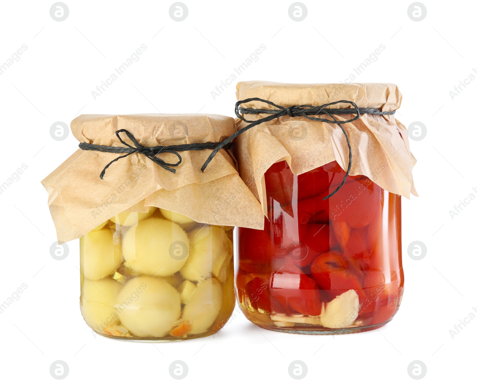 Photo of Different pickled products in jars isolated on white