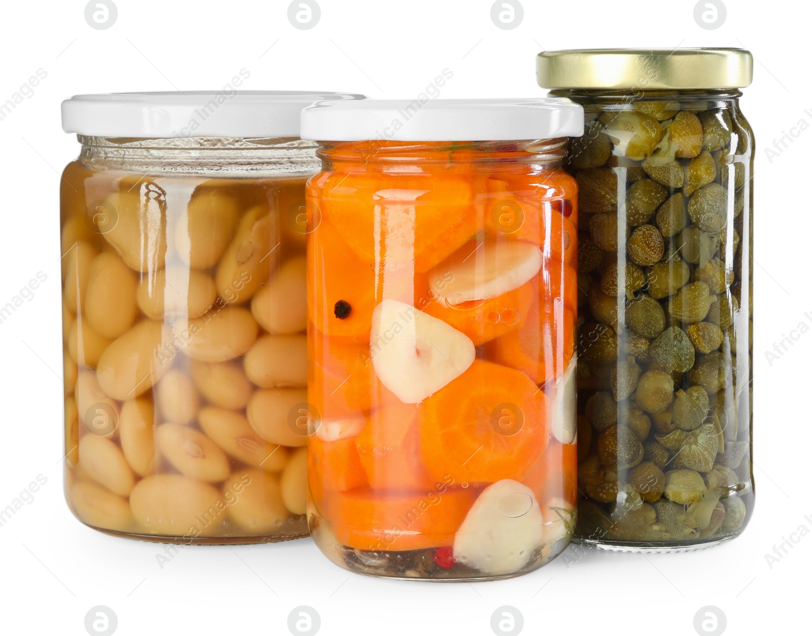 Photo of Different pickled products in jars isolated on white