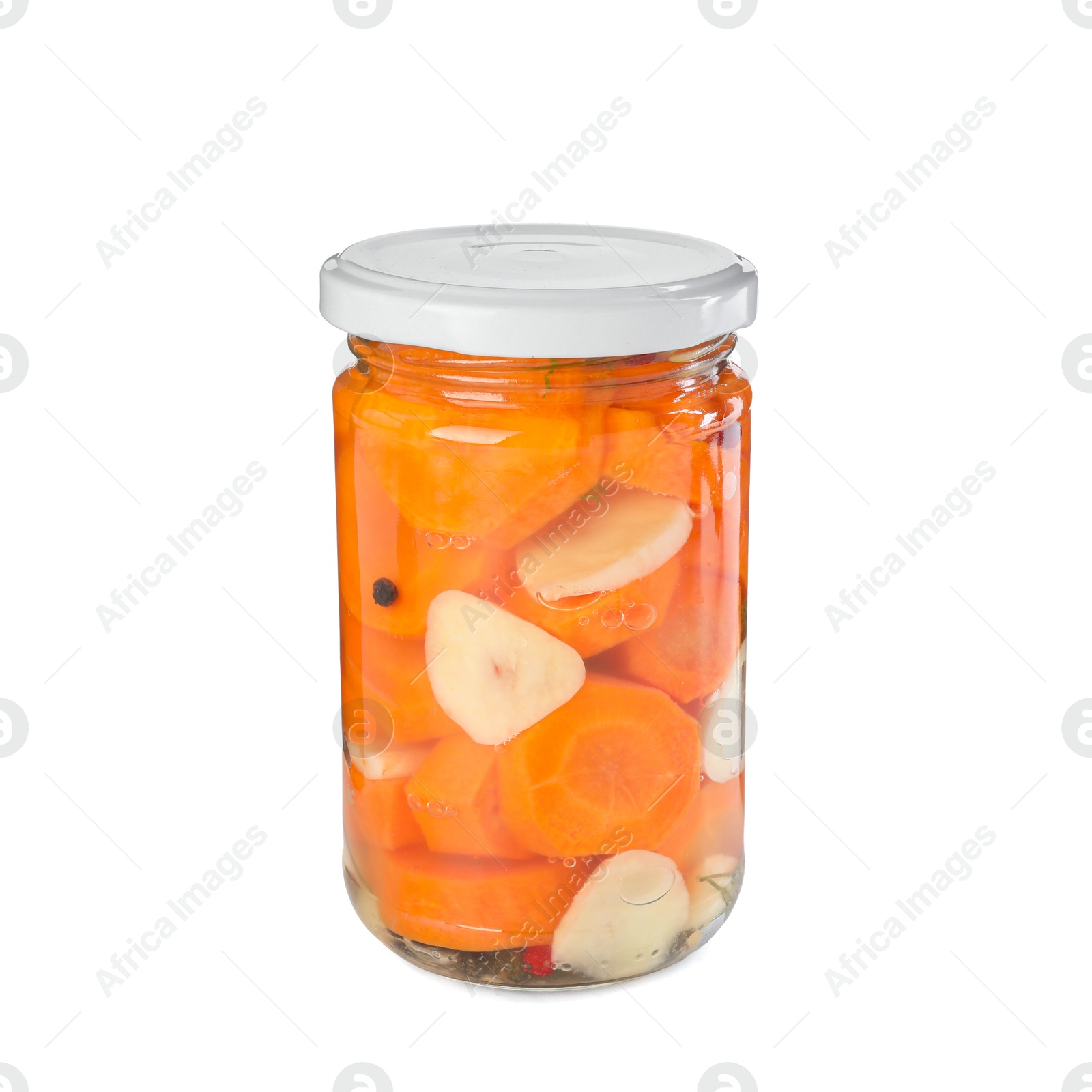 Photo of Tasty pickled carrots in jar isolated on white