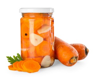 Photo of Tasty pickled carrots in jar and fresh ingredients isolated on white