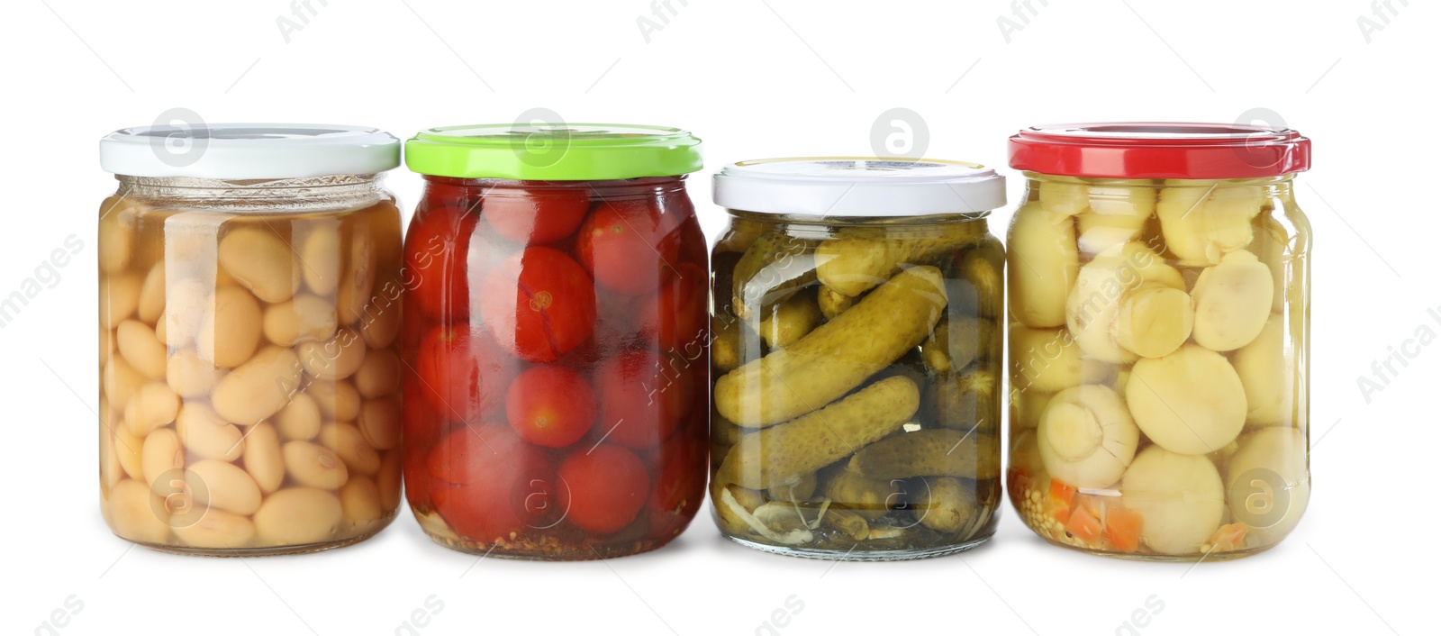 Photo of Different pickled products in jars isolated on white