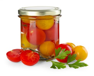 Photo of Tasty pickled tomatoes in jar, fresh vegetables and parsley isolated on white