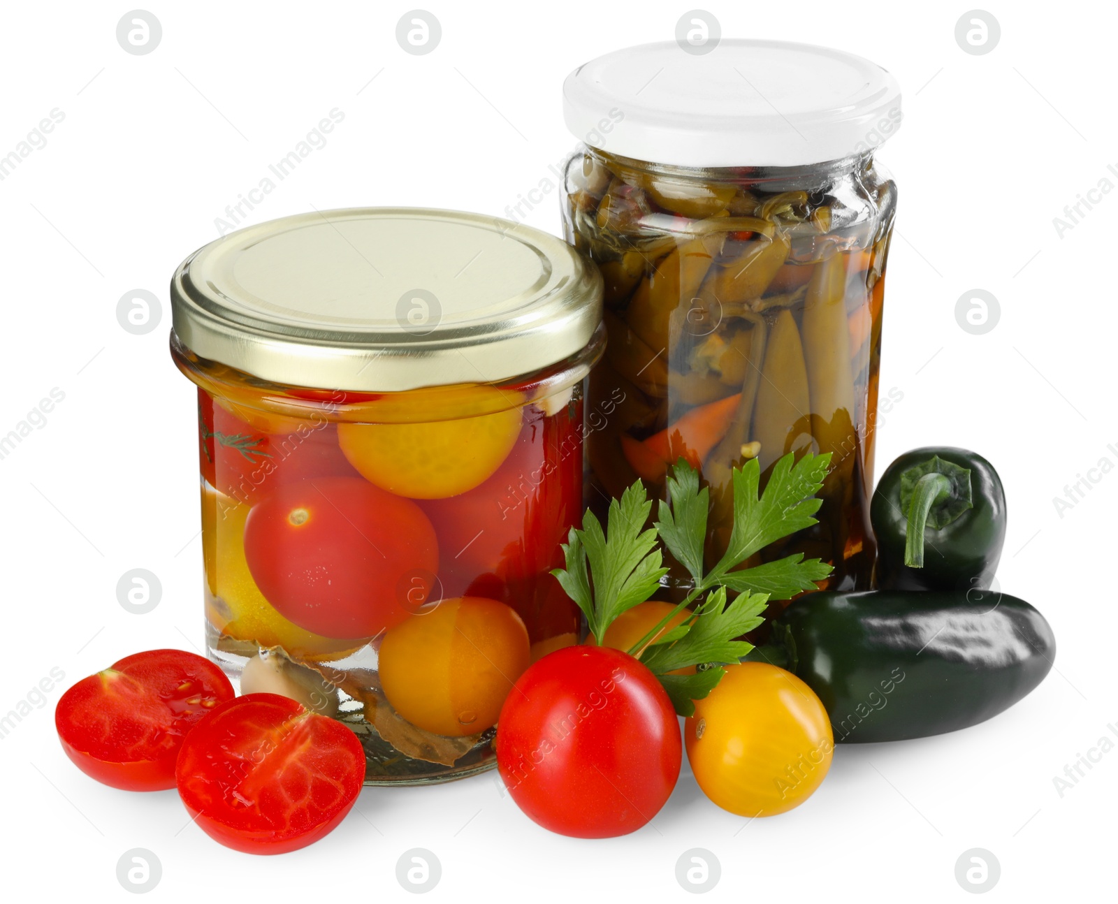 Photo of Tasty pickled vegetables in jars and fresh ingredients isolated on white