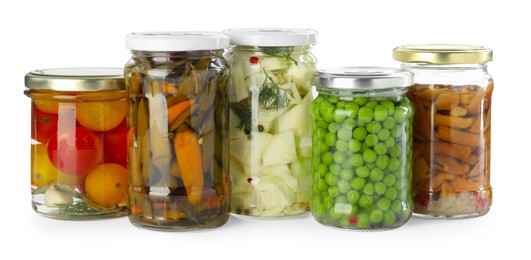 Photo of Different pickled products in jars isolated on white