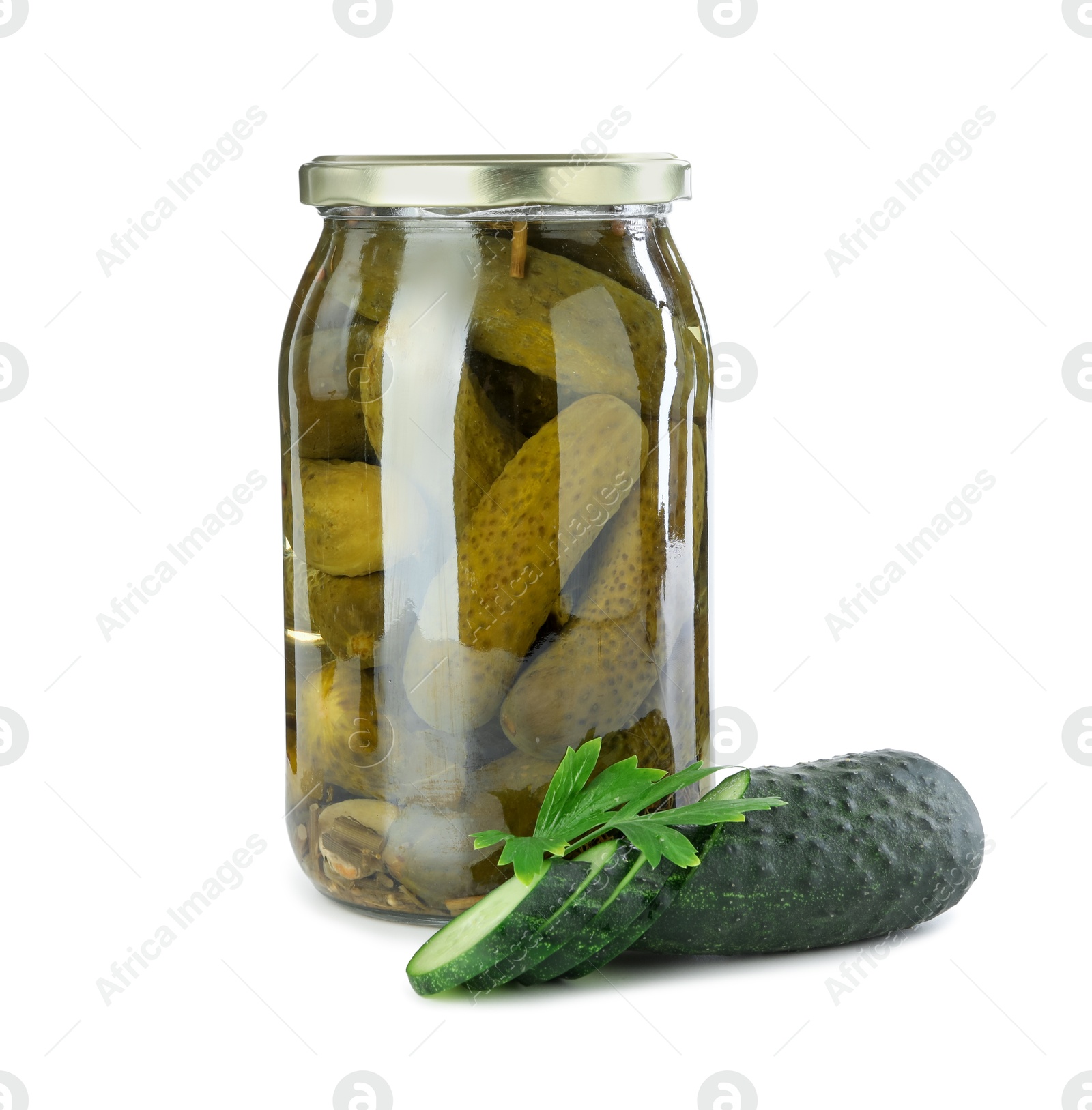 Photo of Tasty pickled cucumbers in jar, fresh vegetable and parsley isolated on white