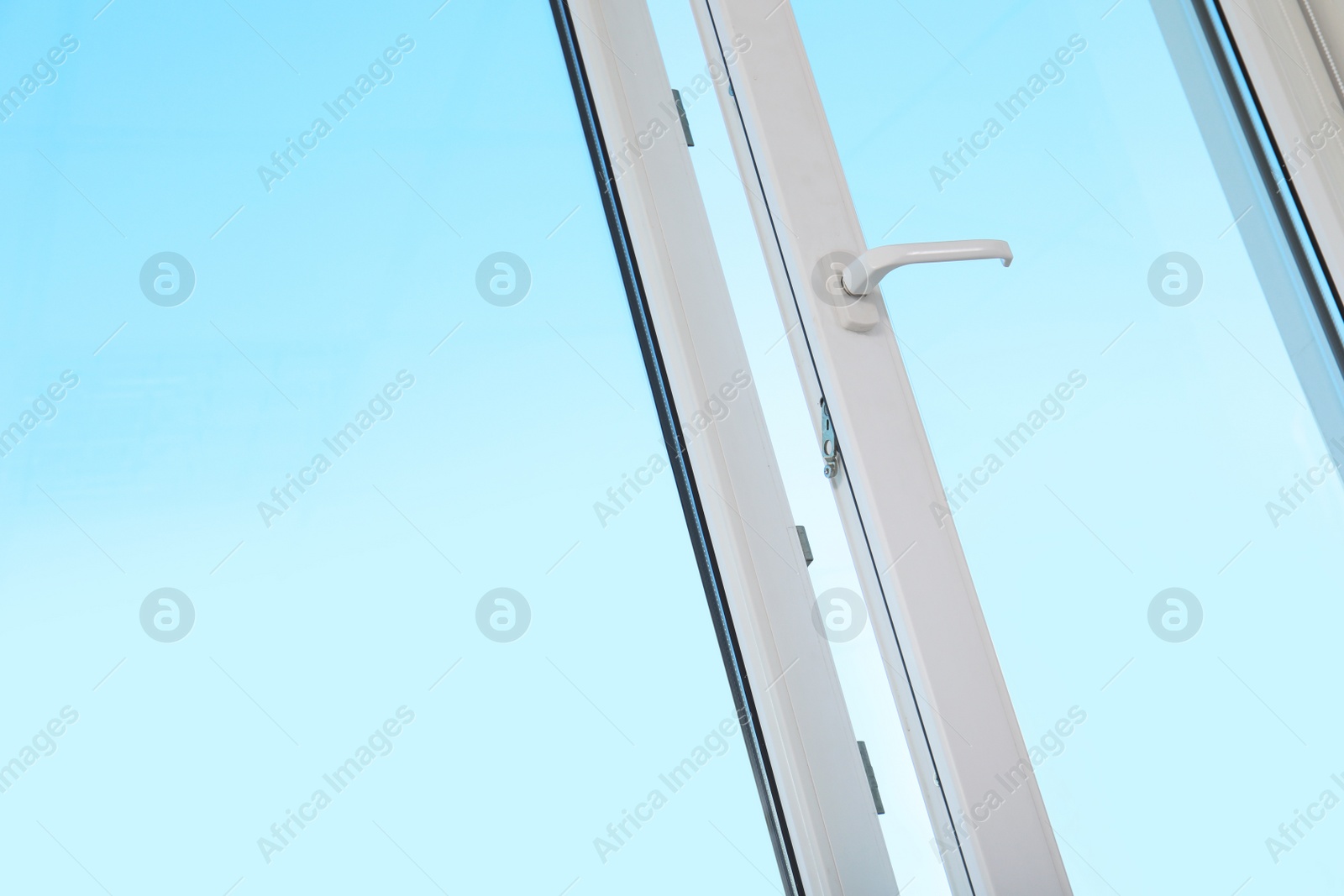 Photo of View of blue sky through modern window indoors