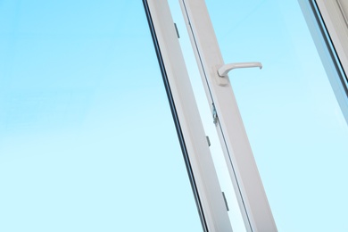 Photo of View of blue sky through modern window indoors