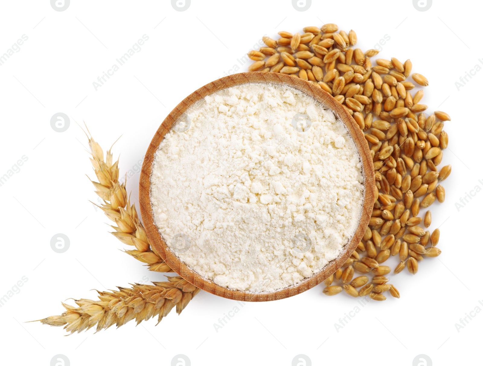 Photo of Bowl with organic flour, spikelets and grains of wheat on white background, top view