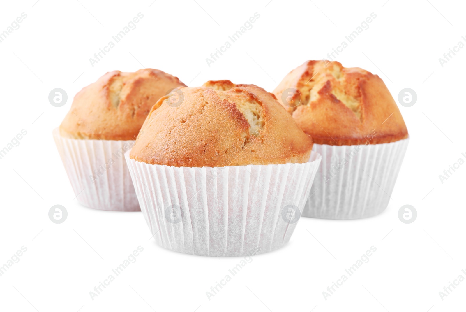 Photo of Tasty muffins in paper cups on white background