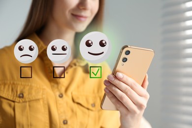 Woman using smartphone to give feedback at home, closeup