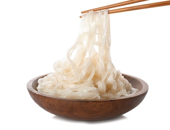 Photo of Taking rice noodles with chopsticks from bowl on white background