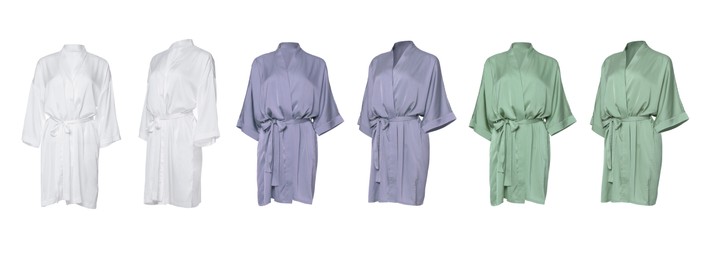 Image of Set of different color silk bathrobes on white background