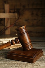 Photo of Judge gavel on old wooden table. Biblical concept