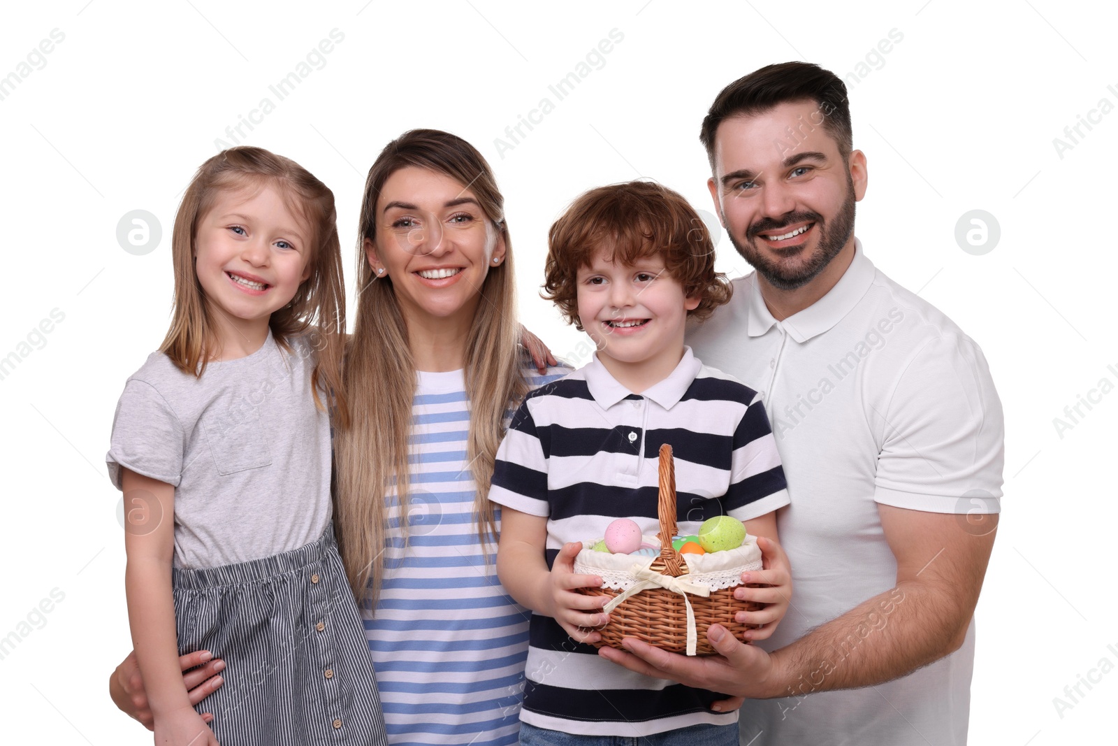 Photo of Easter celebration. Happy family with wicker basket full of painted eggs isolated on white