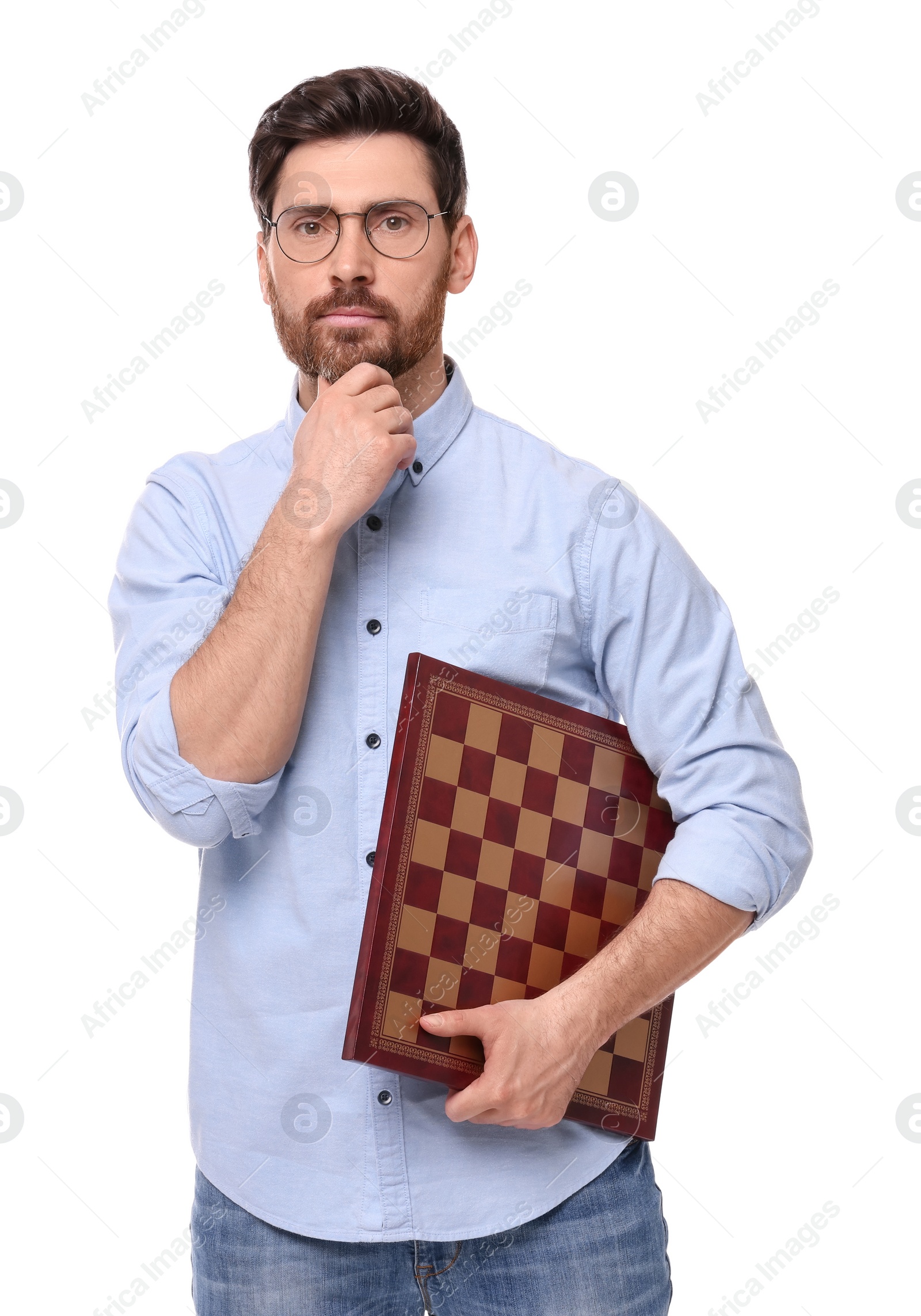 Photo of Thoughtful man holding chessboard on white background