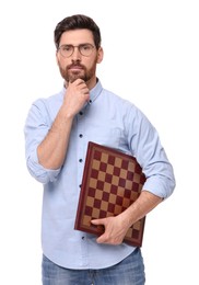 Photo of Thoughtful man holding chessboard on white background