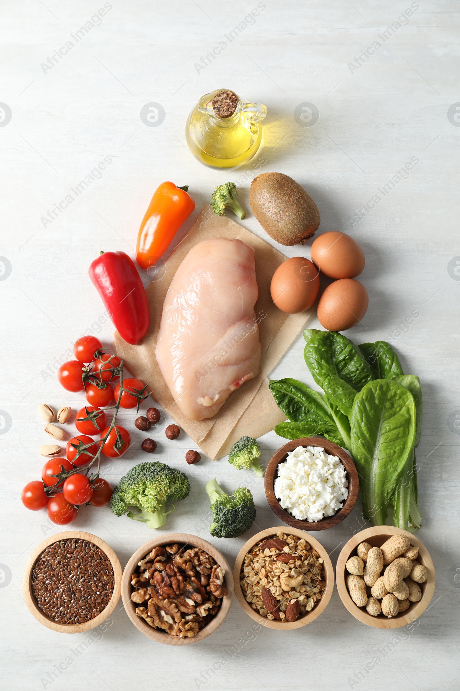 Photo of Many different healthy food on white wooden table, flat lay