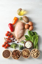 Many different healthy food on white wooden table, flat lay