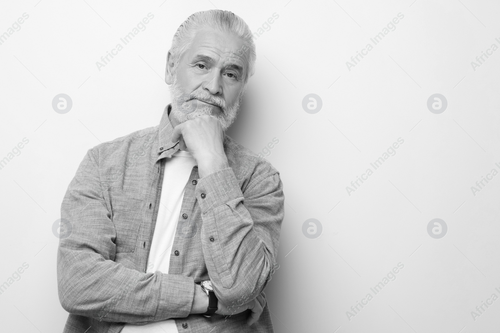 Image of Portrait of handsome senior man on light background, space for text. Black and white effect