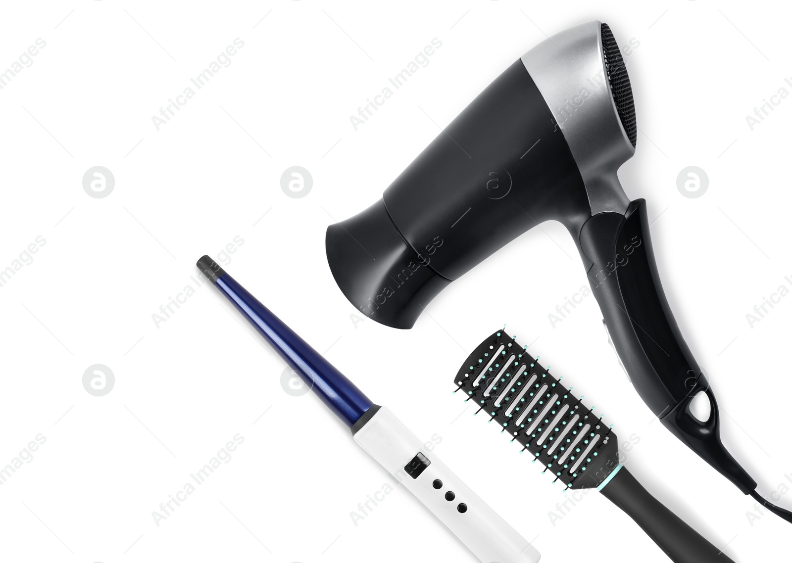 Image of Hair dryer, round brush and curling iron on white background, top view