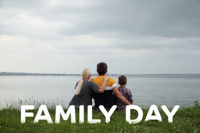 Image of Little boy and grandparents spending time together near river, back view. Happy Family Day