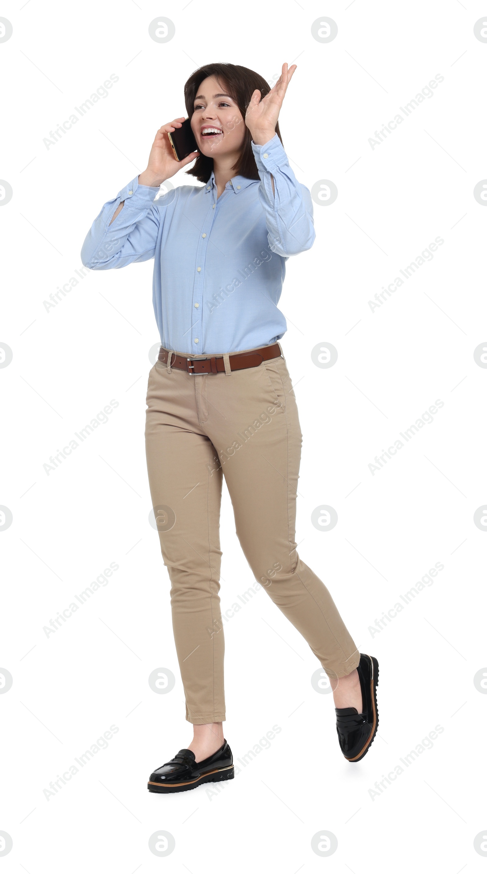 Photo of Happy businesswoman woman talking on smartphone against white background