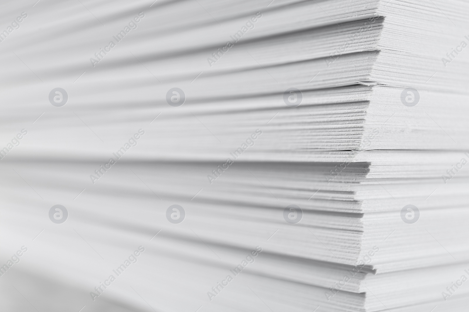 Photo of Stack of blank white paper as background, closeup