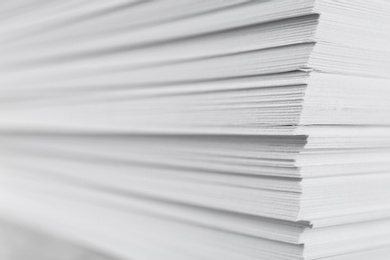 Photo of Stack of blank white paper as background, closeup