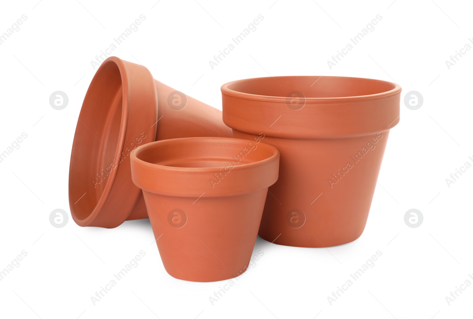 Photo of Empty clay flower pots isolated on white