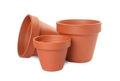 Photo of Empty clay flower pots isolated on white