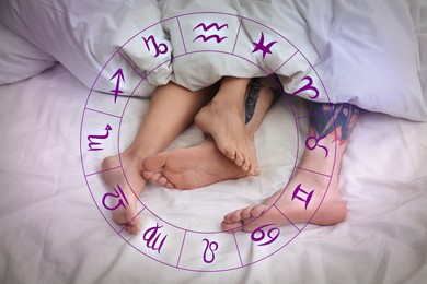 Image of Sexual compatibility. Zodiac wheel and passionate couple having sex on bed, closeup of legs