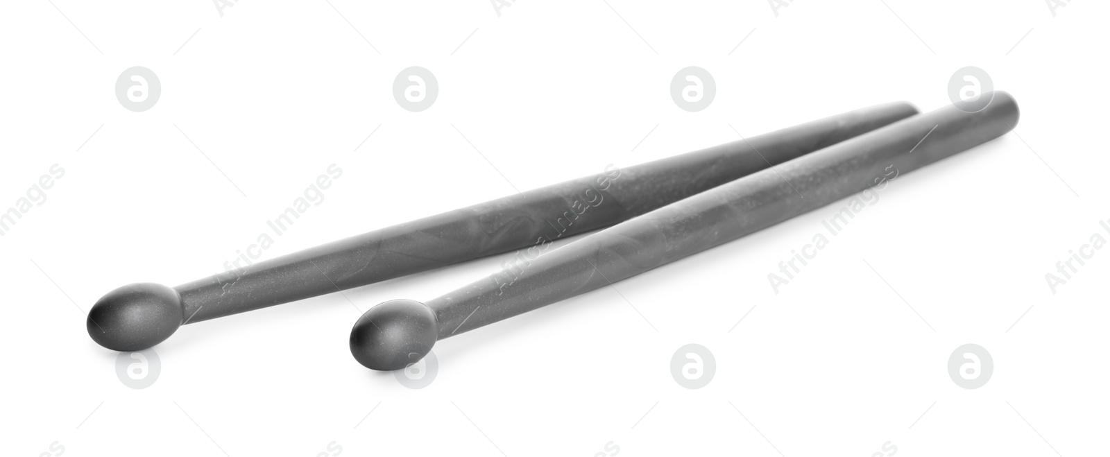 Photo of Two grey drum sticks isolated on white