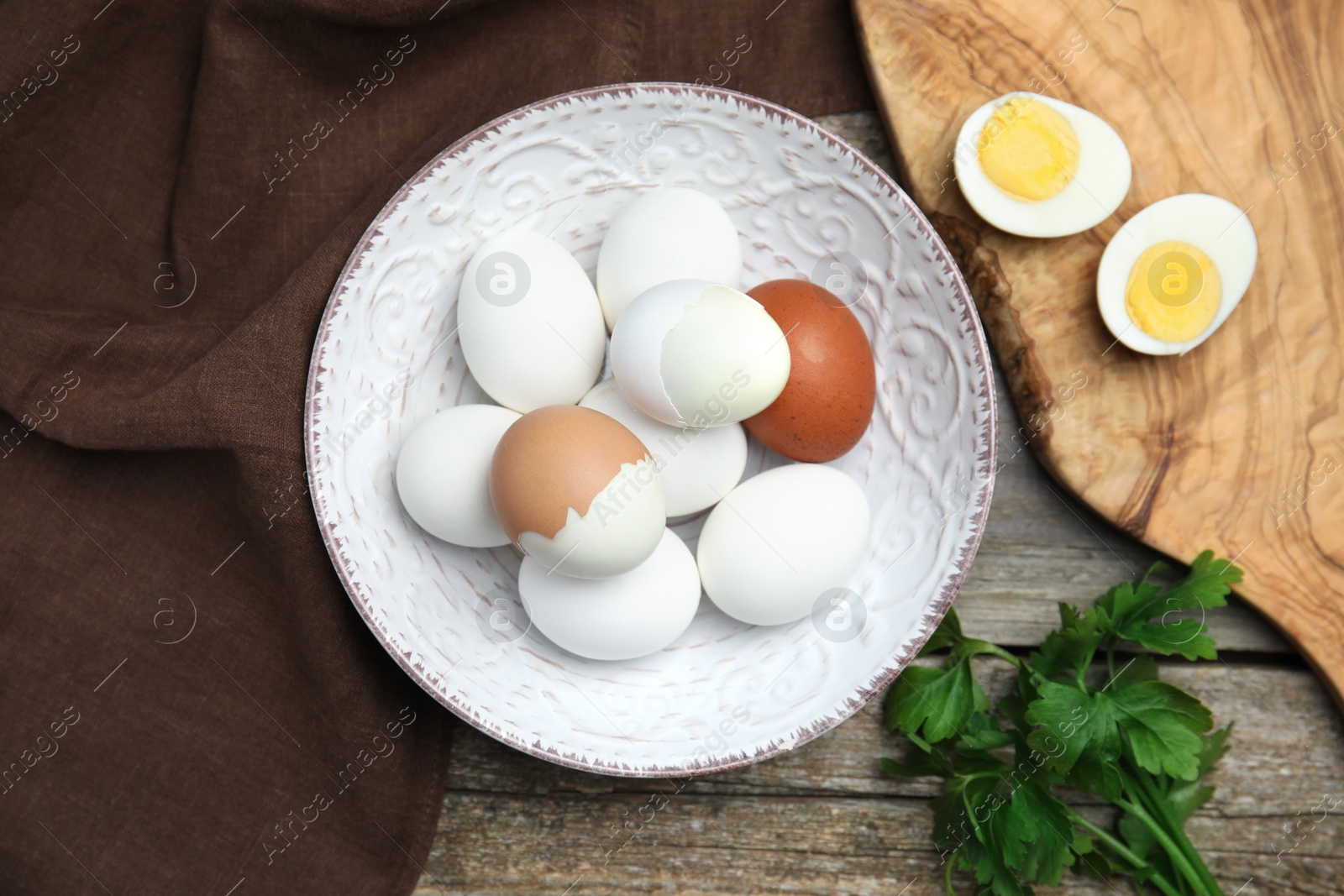 Photo of Flat lay composition with boiled eggs on wooden table