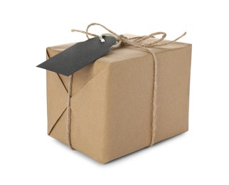 Photo of Parcel wrapped in kraft paper with tag on white background