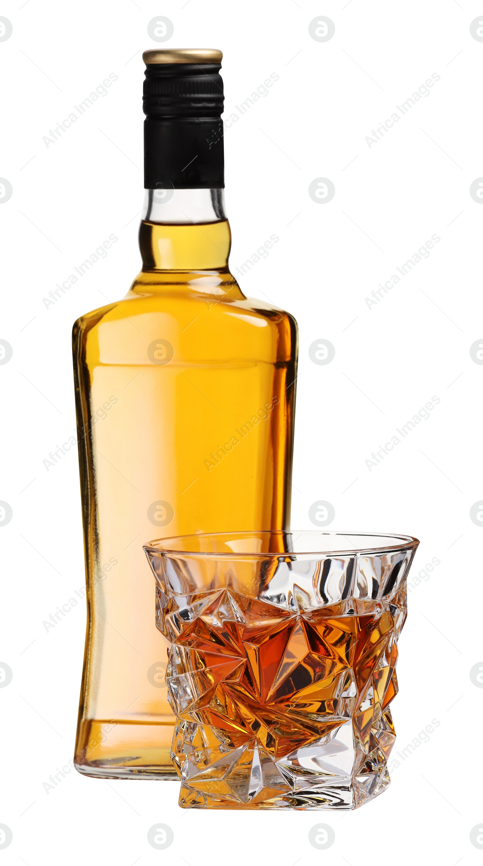 Photo of Glass and bottle of whiskey isolated on white