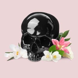 Image of Black skull and beautiful flowers on beige background