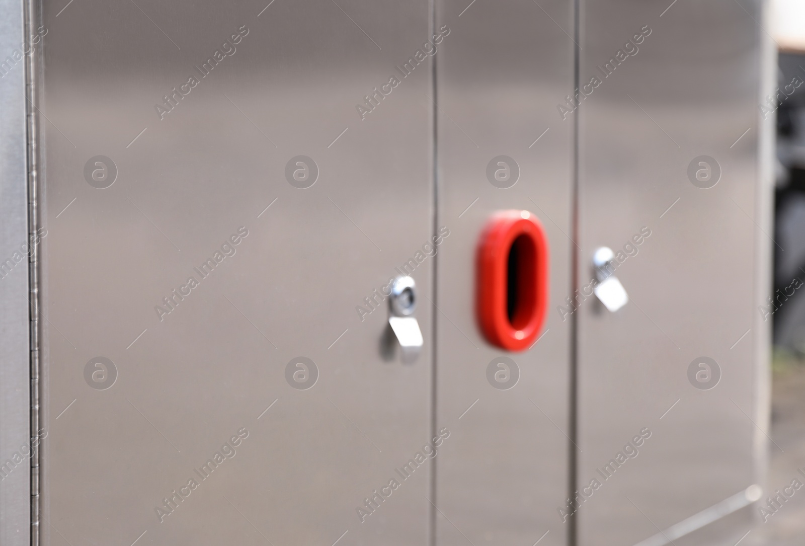 Photo of Modern metal recycling bin outdoors, closeup view