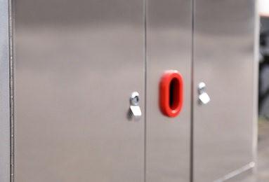 Photo of Modern metal recycling bin outdoors, closeup view