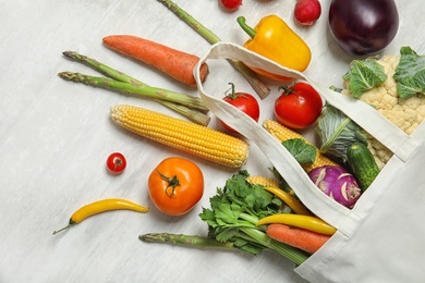Photo of Flat lay composition with fresh vegetables on light background