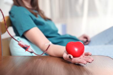 Teenager donating blood in hospital, closeup view