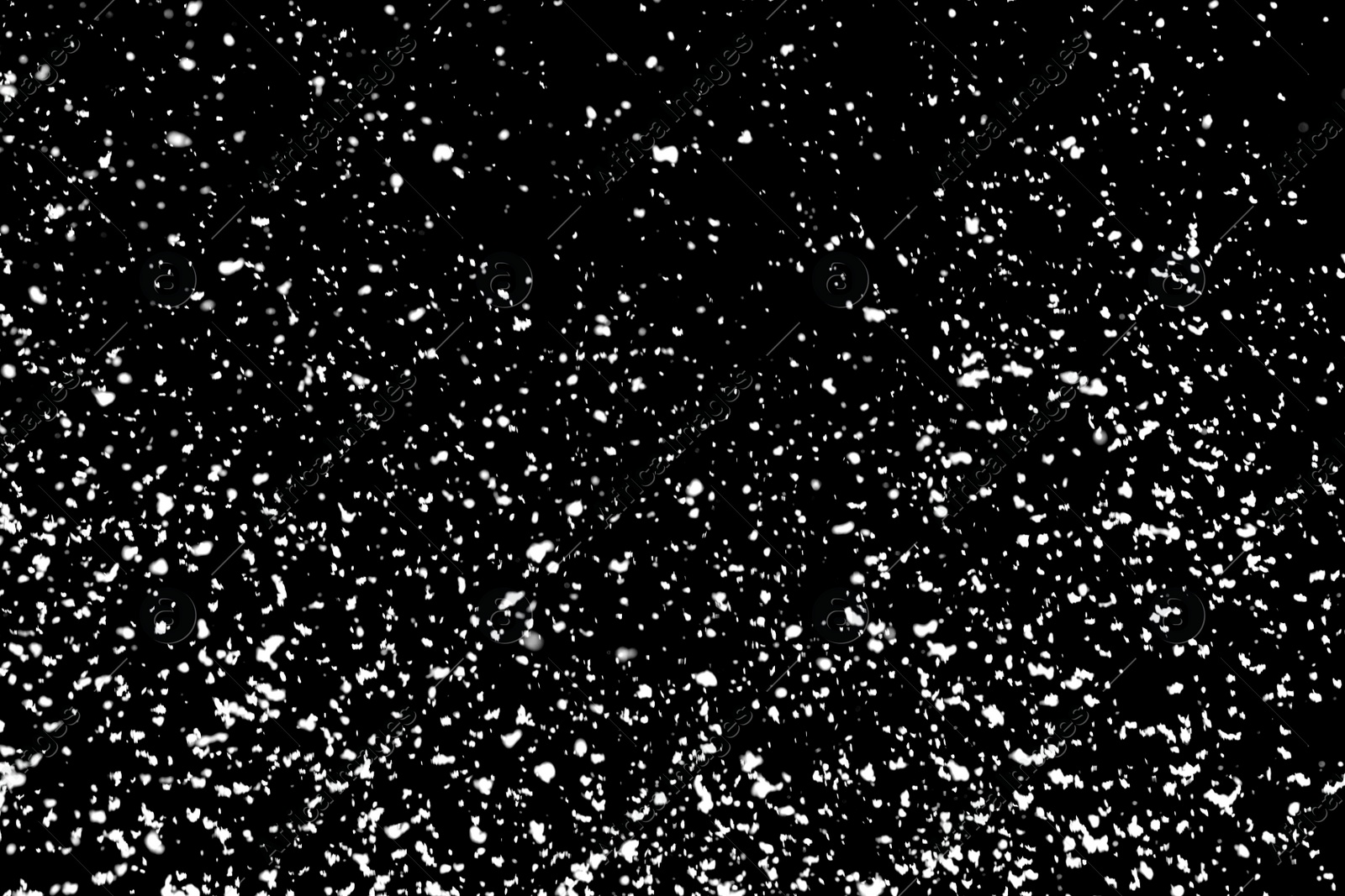 Photo of White snow falling down on black background