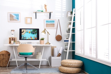 Photo of Home workplace with modern computer and desk in room