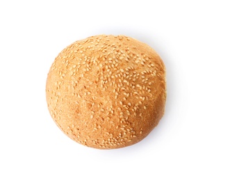 Photo of Fresh burger bun with sesame seeds isolated on white, top view