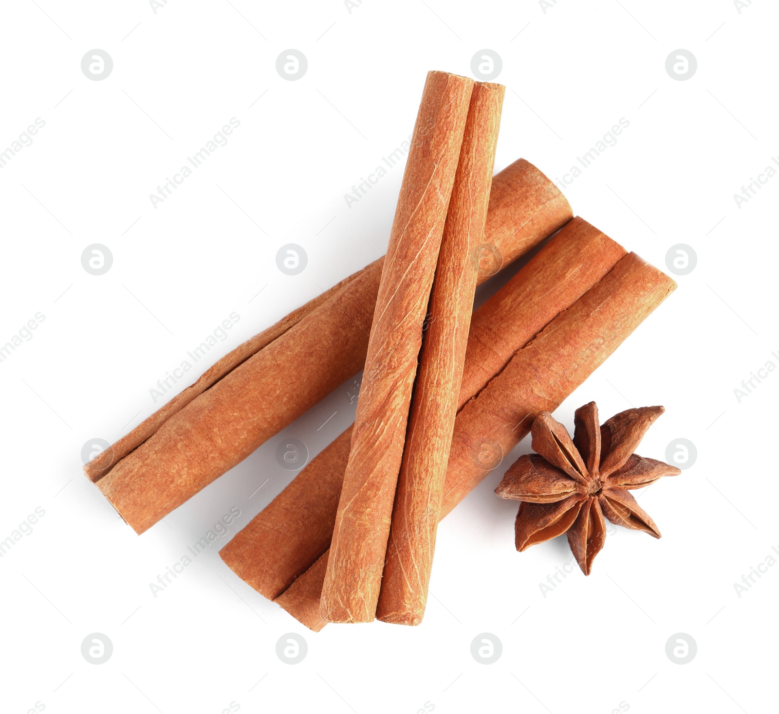 Photo of Cinnamon sticks and anise star isolated on white, top view