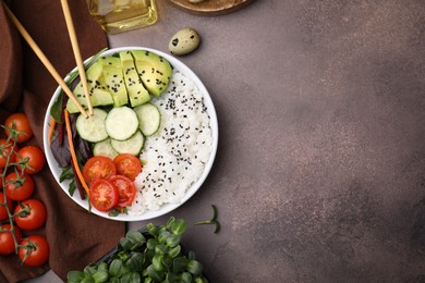 Photo of Delicious poke bowl and ingredients on textured table, flat lay. Space for text