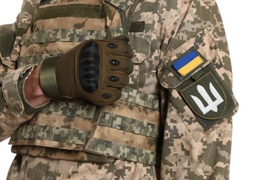 Photo of Soldier with Ukrainian flag and trident on military uniform against white background, closeup