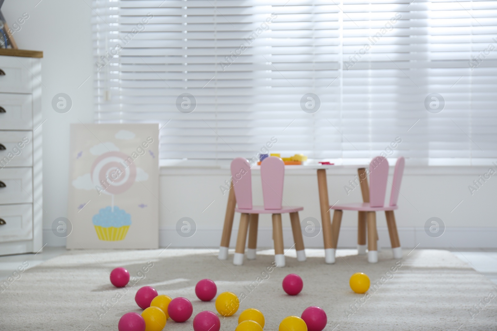 Photo of Baby room interior with stylish furniture and toys