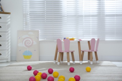 Baby room interior with stylish furniture and toys